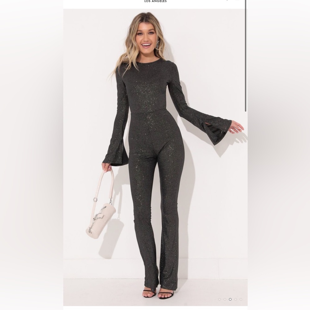 Lucy in the Sky size medium black sparkles jump suit